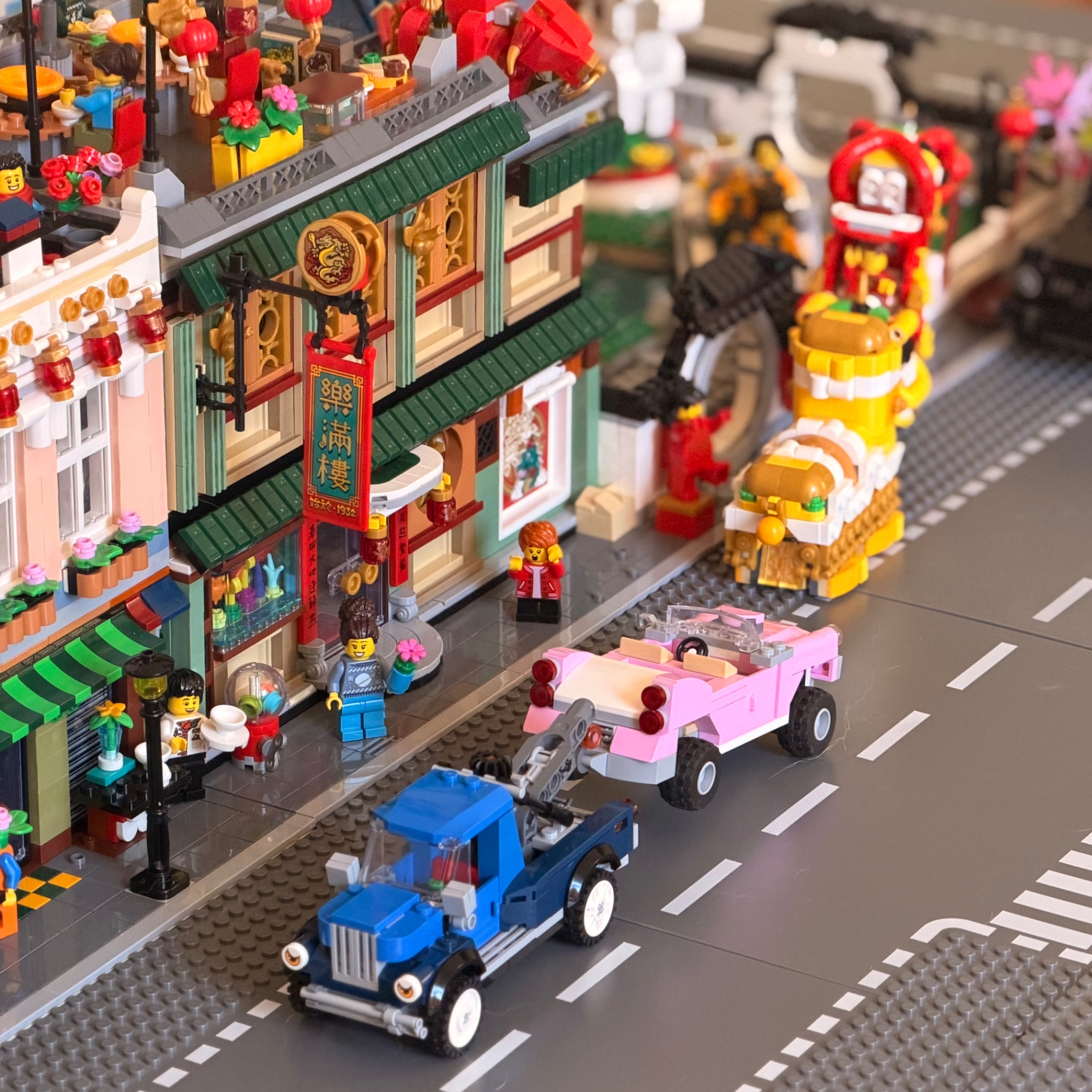 Lego city street scene showing plenty of parking with Lego cars